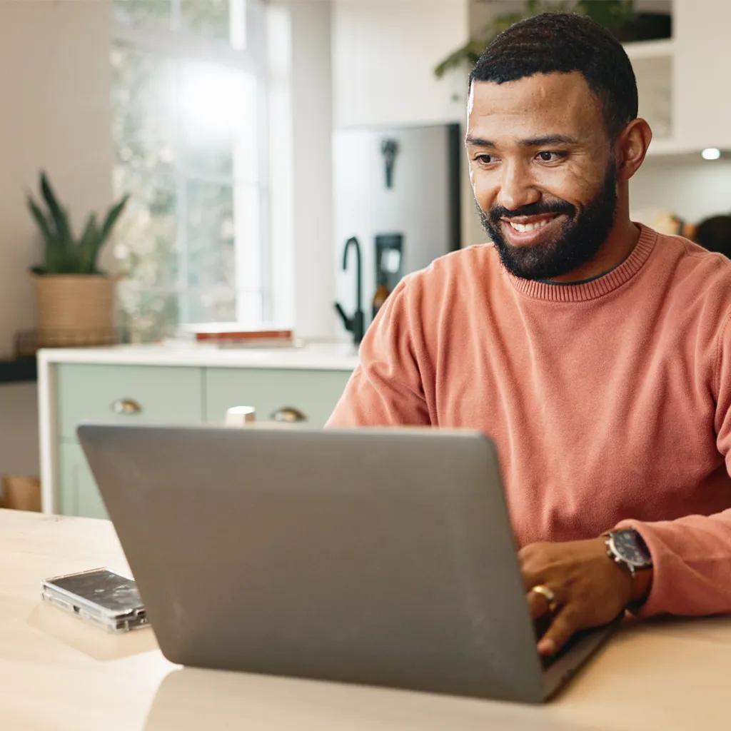 man at home with online therapist