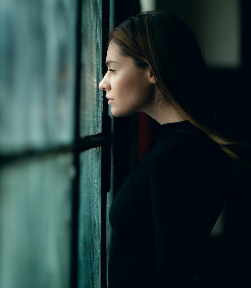 Photo of young woman reflecting lifes issues